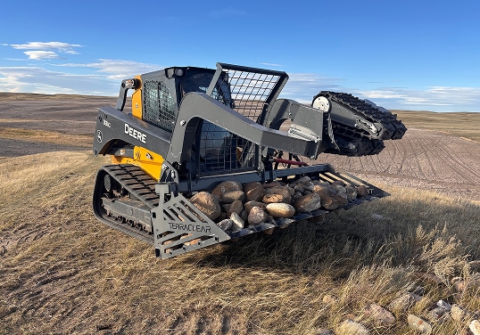 Rock picker in field
