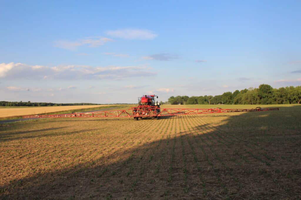Tractor in field spraying