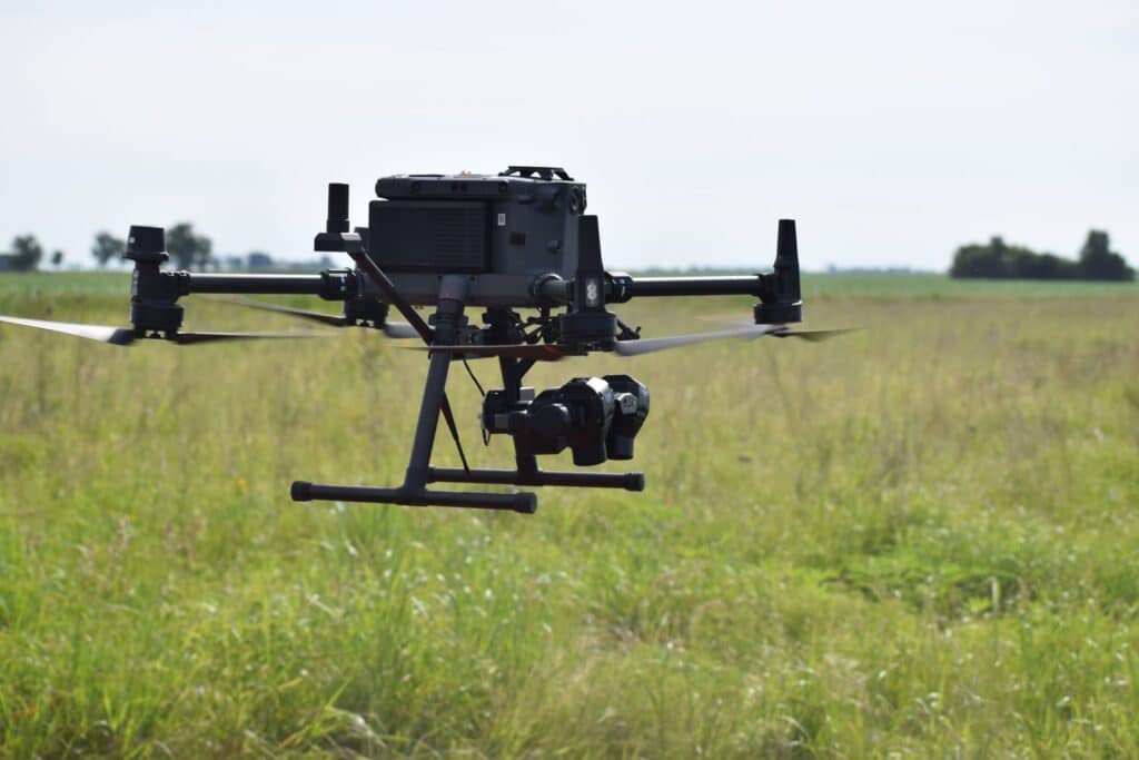 TerraClear mapping drone with camera flying over a farm field to capture high-resolution imagery for rock and weed maps