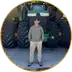 Rylan Bray, farmer in Manitoba, standing in front of his tractor